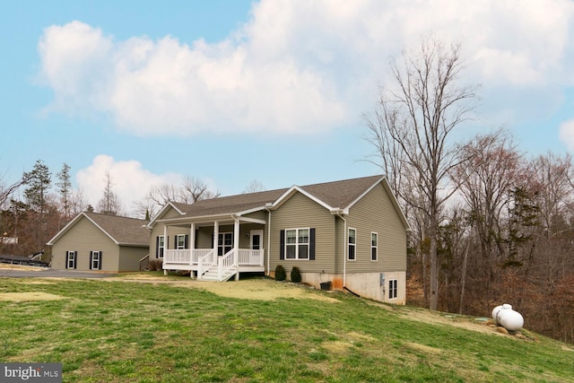 view of front of property with a porch and a front yard