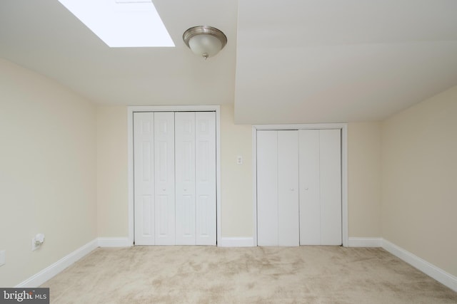 unfurnished bedroom featuring baseboards and carpet floors