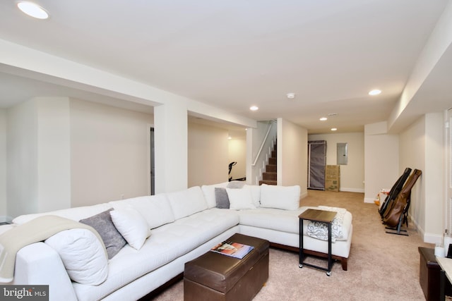 living room featuring stairway, baseboards, electric panel, recessed lighting, and light carpet