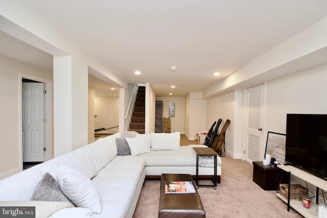 living room with recessed lighting, stairway, light carpet, and baseboards