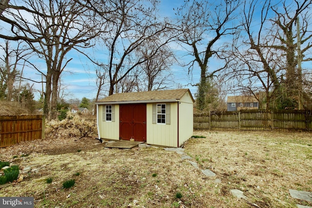 view of shed featuring a fenced backyard