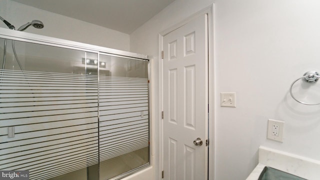 full bath featuring an enclosed shower