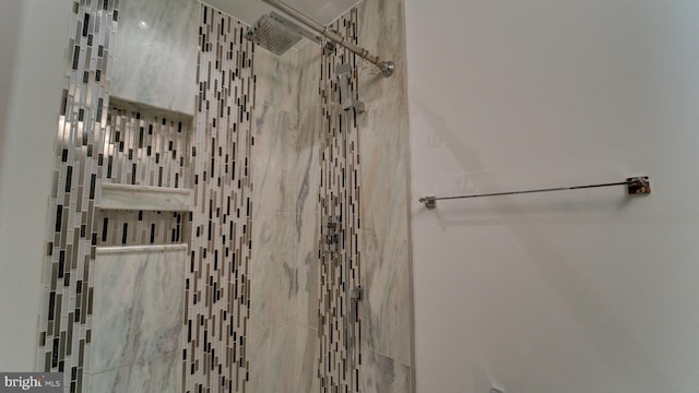 full bathroom with a tile shower