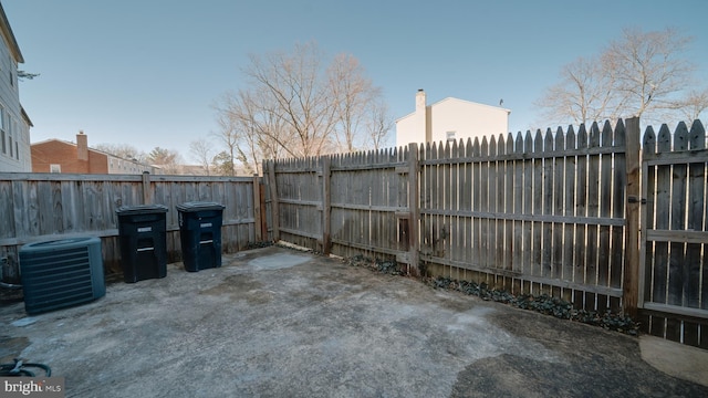 view of patio featuring central AC and a fenced backyard