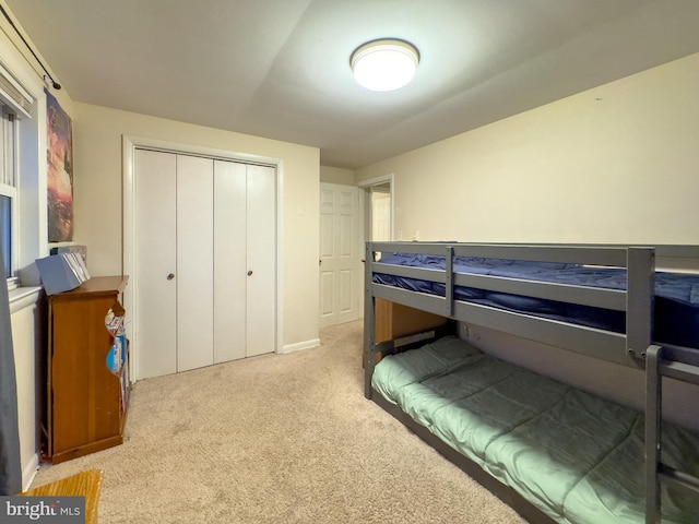 carpeted bedroom with a closet