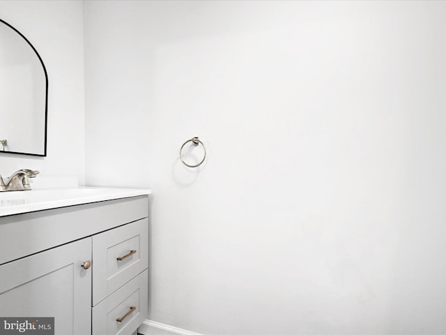 bathroom featuring vanity and baseboards