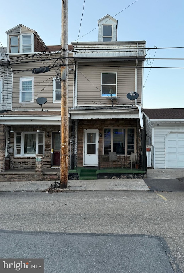 multi unit property featuring a porch