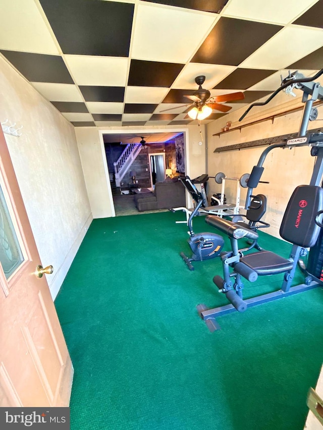 exercise area with a paneled ceiling