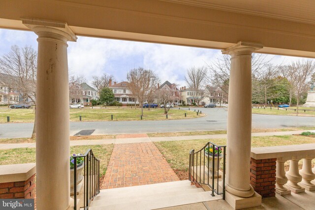 view of patio / terrace featuring a residential view and a porch