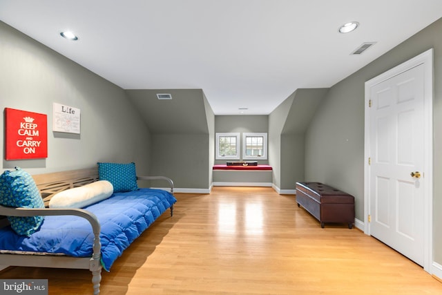 bedroom featuring recessed lighting, light wood-style floors, visible vents, and baseboards