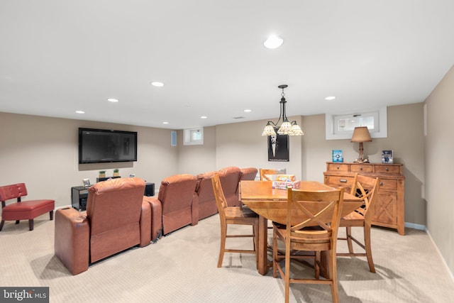 dining room with recessed lighting, light colored carpet, and baseboards