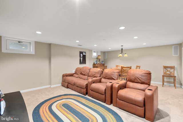 home theater featuring light carpet, recessed lighting, and baseboards