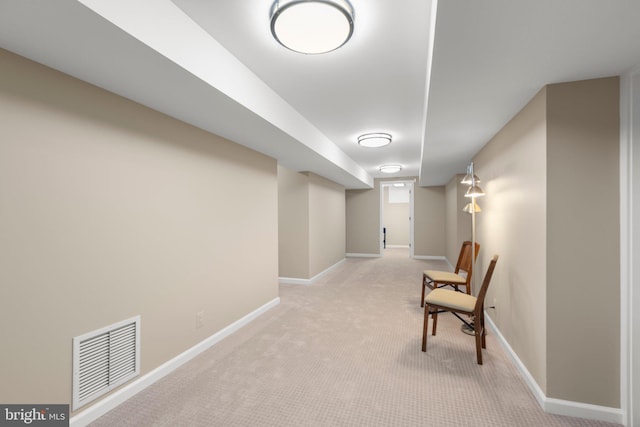 sitting room featuring visible vents, baseboards, and carpet flooring