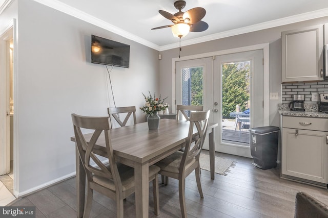 dining space featuring light wood-type flooring, baseboards, crown molding, and french doors