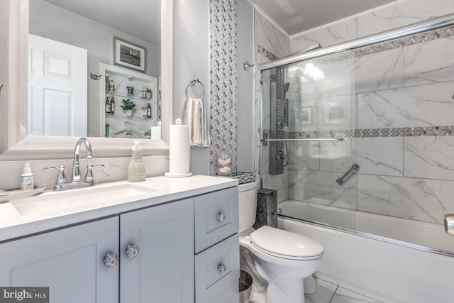 bathroom with vanity, toilet, marble finish floor, and combined bath / shower with glass door