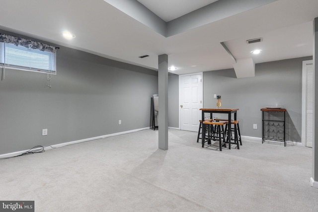 basement with recessed lighting, visible vents, baseboards, and carpet flooring