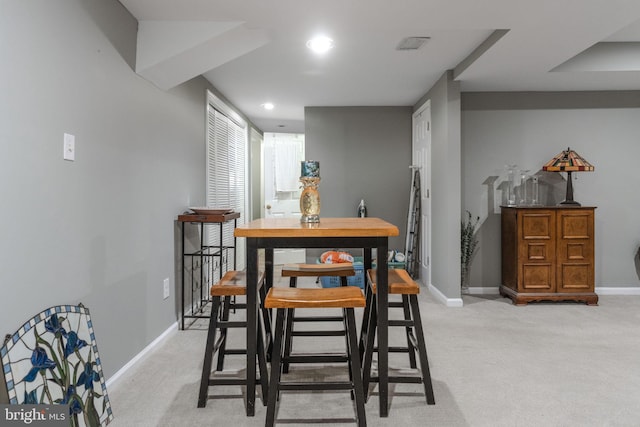 dining area featuring visible vents, recessed lighting, light colored carpet, and baseboards