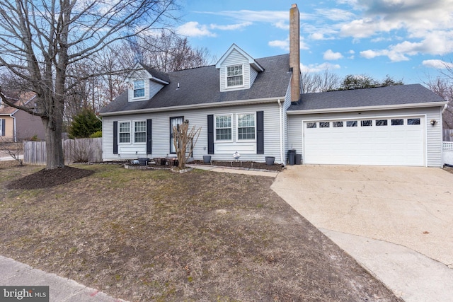 cape cod-style house featuring fence, a garage, driveway, and roof with shingles