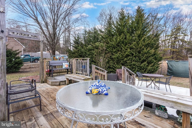 wooden deck with outdoor dining space