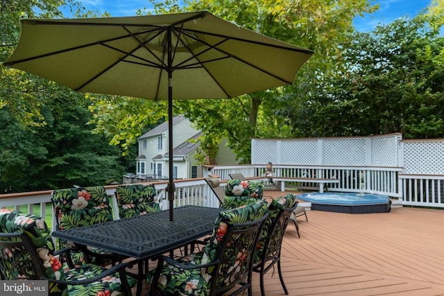 wooden terrace with outdoor dining space