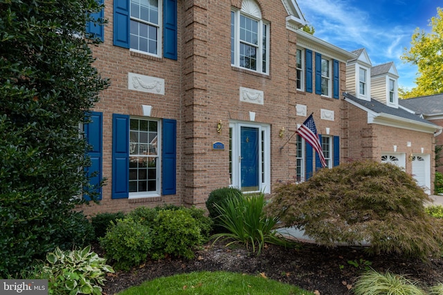 view of front of house featuring brick siding