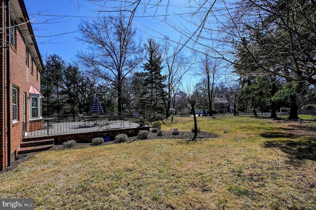 view of yard featuring a wooden deck