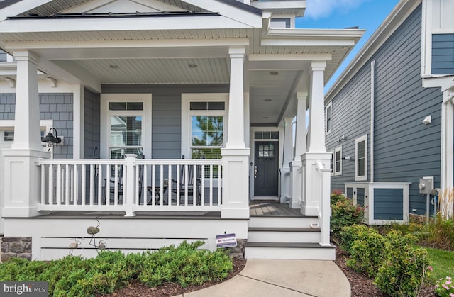 doorway to property with a porch