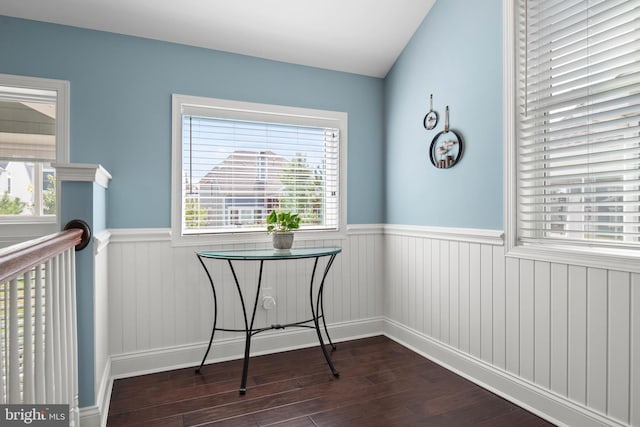 interior space with wainscoting and dark wood finished floors