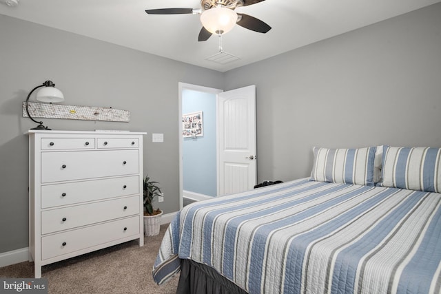 bedroom with carpet, a ceiling fan, and baseboards