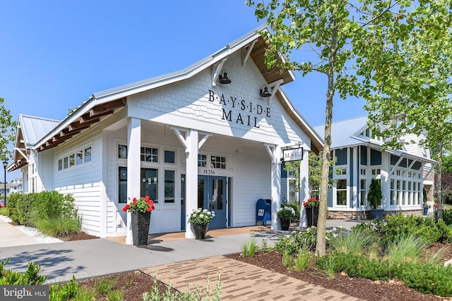 view of front of house with french doors and metal roof