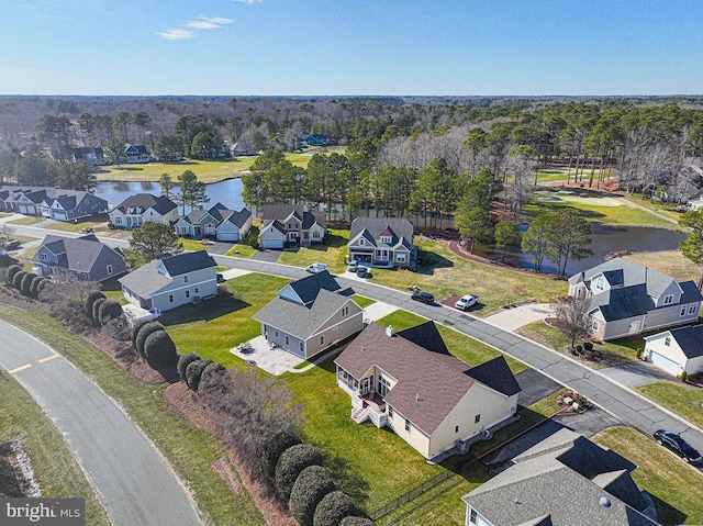 drone / aerial view with a residential view and a water view