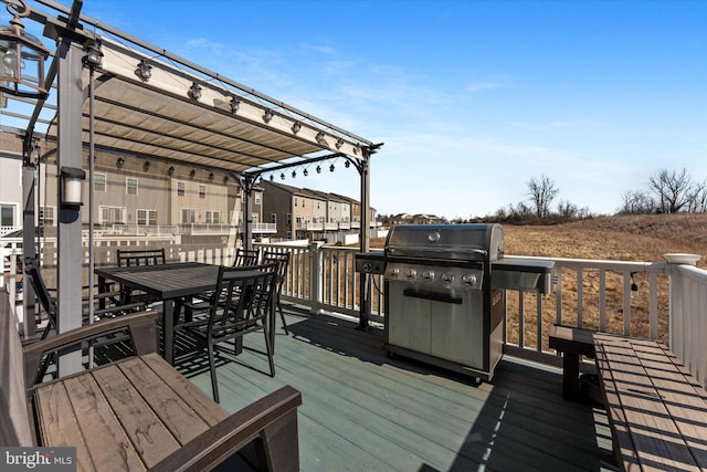 wooden terrace featuring outdoor dining space