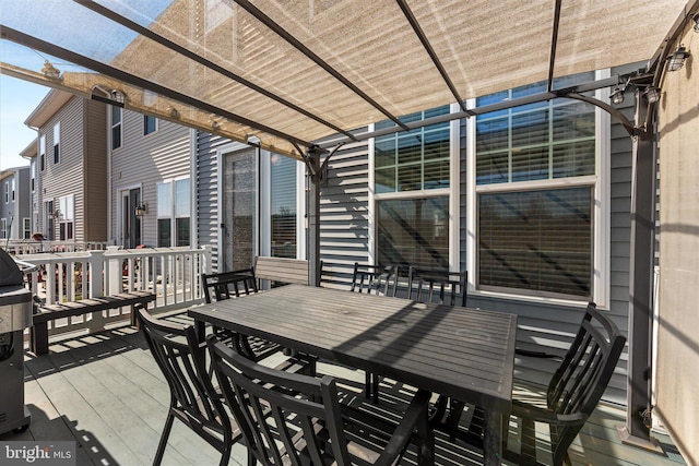 wooden deck with outdoor dining area