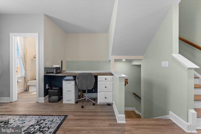 home office with baseboards and light wood-style floors