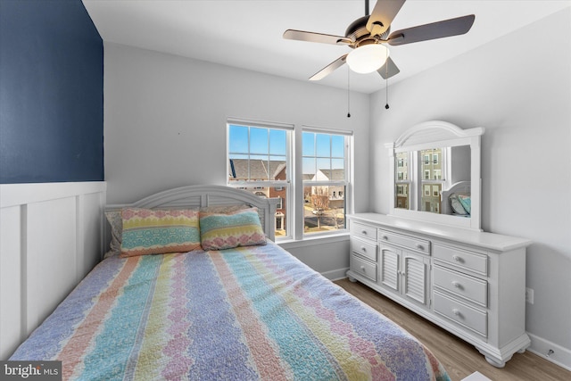 bedroom featuring wood finished floors and ceiling fan