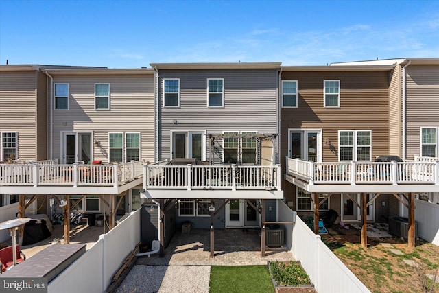 back of property with a patio, central AC unit, and a fenced backyard