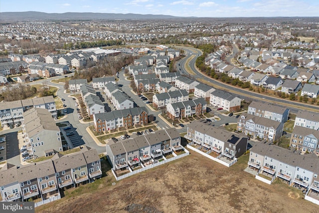 drone / aerial view featuring a residential view and a mountain view