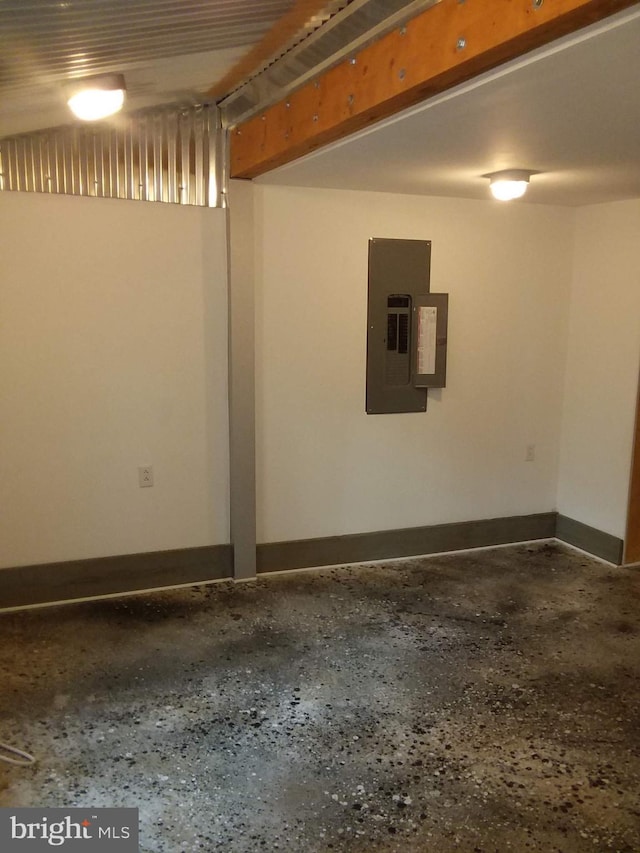 basement with electric panel and baseboards