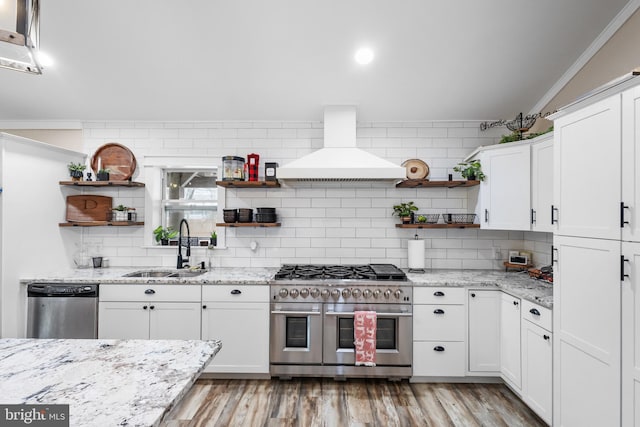 kitchen with stainless steel appliances, a sink, white cabinets, range hood, and open shelves