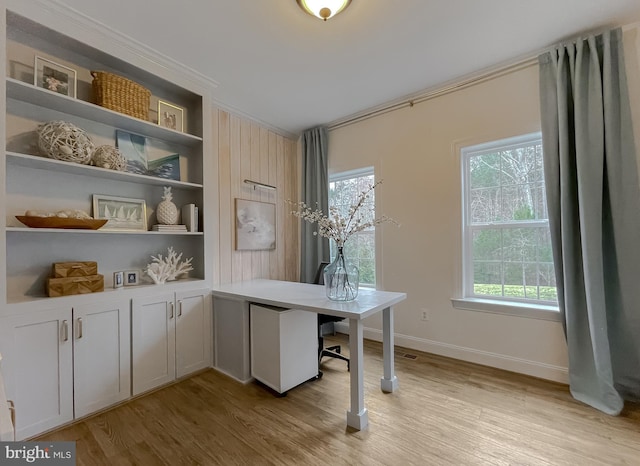 office with baseboards and light wood-type flooring