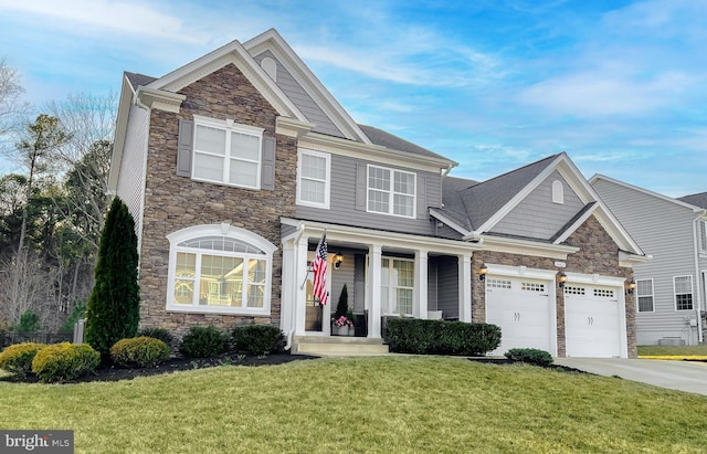 view of front of house with stone siding, concrete driveway, and a front yard