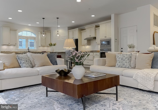 living area featuring recessed lighting