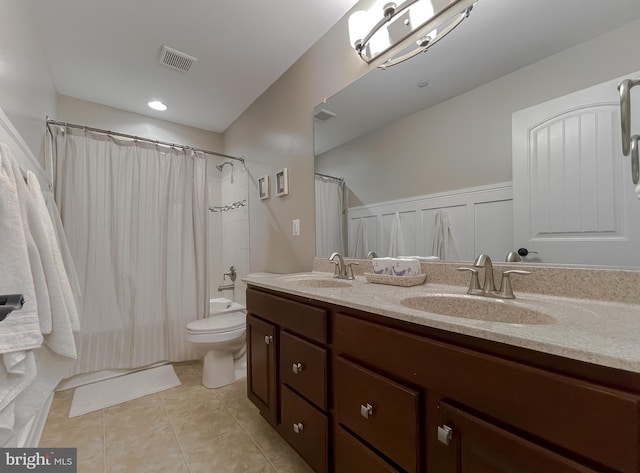 full bathroom featuring a sink, visible vents, toilet, and tile patterned flooring