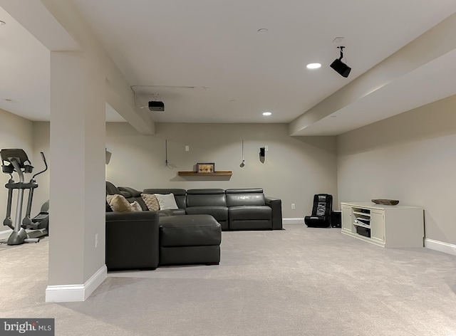 living room featuring baseboards and light carpet