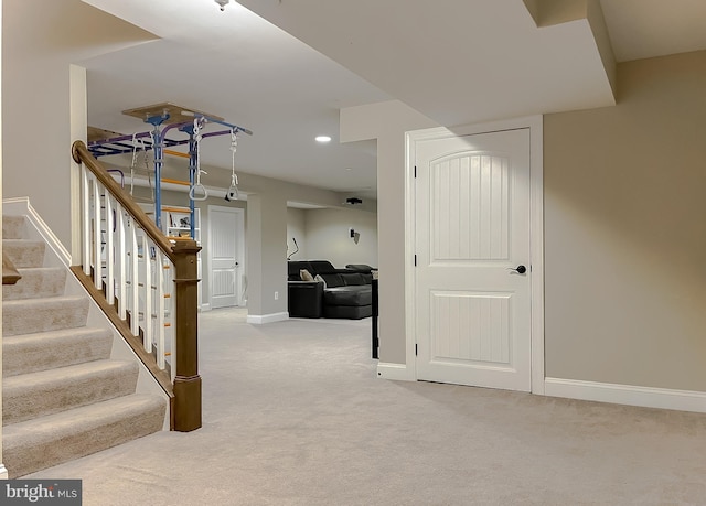 interior space featuring carpet flooring, recessed lighting, and baseboards