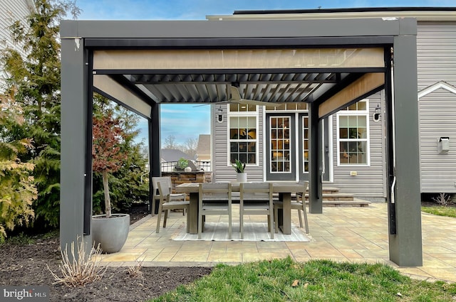 view of patio with a pergola and outdoor dining area