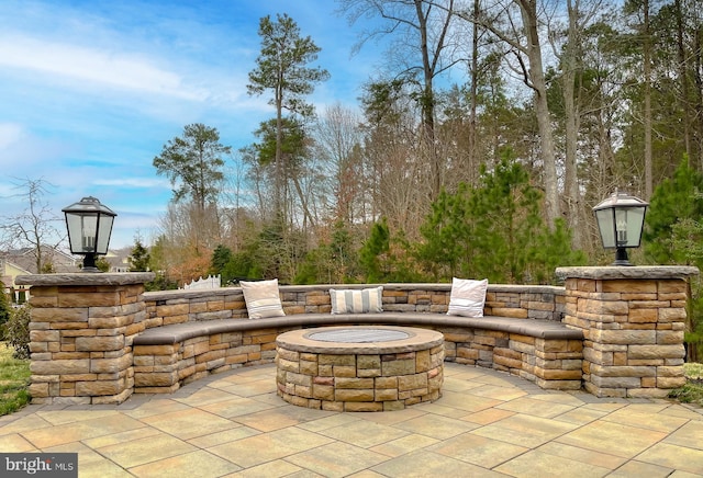 view of patio with an outdoor fire pit