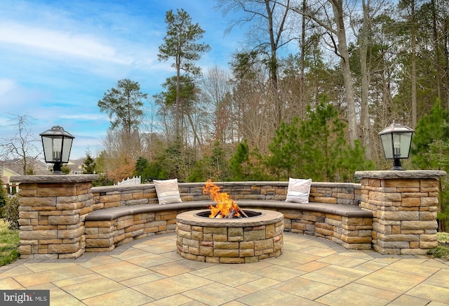 view of patio with a fire pit