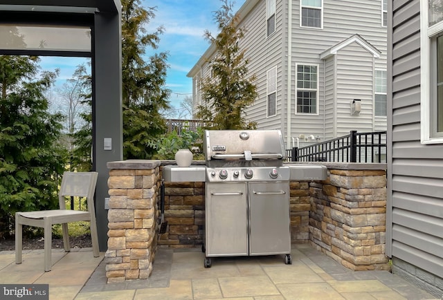 view of patio / terrace with area for grilling and an outdoor kitchen