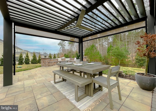 view of patio featuring outdoor dining area, fence, and a pergola